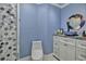 Bathroom featuring a decorative bowl sink, mirror, and white vanity with a gray countertop at 10958 Sw 86Th Ct, Ocala, FL 34481