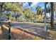Spacious empty lot with mature trees and partial fence, offering potential for building or recreation at 10958 Sw 86Th Ct, Ocala, FL 34481