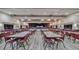 Spacious event space with hardwood floors and stage, perfect for large gatherings and celebrations at 10958 Sw 86Th Ct, Ocala, FL 34481
