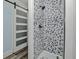 Shower with gray and white hexagon tile and black hardware at 10958 Sw 86Th Ct, Ocala, FL 34481