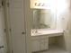 Bathroom with wide vanity, mirror, and tiled floor at 11353 Sw 138Th Ln, Dunnellon, FL 34432