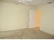 Bedroom showcasing neutral walls and carpet with a ceiling fan and a view of a closet at 11353 Sw 138Th Ln, Dunnellon, FL 34432