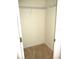 Walk-in closet with hanging rods and neutral walls at 11353 Sw 138Th Ln, Dunnellon, FL 34432