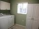 Laundry room featuring a washer and dryer at 11353 Sw 138Th Ln, Dunnellon, FL 34432
