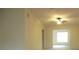 Bright living area with vaulted ceilings, ceiling fan, and neutral walls, creating a welcoming space at 11353 Sw 138Th Ln, Dunnellon, FL 34432