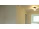 Neutral living room with a ceiling fan and large window for natural light at 11353 Sw 138Th Ln, Dunnellon, FL 34432
