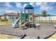 Community playground with colorful play structures and a safe rubber surface, perfect for children to enjoy at 1157 Saguaro St, Haines City, FL 33844