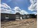 Construction progress shot, showcasing the block framework under a bright sky with fluffy clouds at 120 Dogwood Drive Cir, Ocala, FL 34472