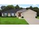 Charming single Gathering home with a two-car garage, manicured lawn and lovely landscaping at 120 Dogwood Drive Cir, Ocala, FL 34472