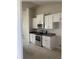 New kitchen features white cabinets, modern appliances and a contrasting countertop at 120 Dogwood Drive Cir, Ocala, FL 34472