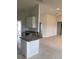 Kitchen with white cabinets, stainless steel appliances, granite countertops, and access to the outdoors at 120 Dogwood Drive Cir, Ocala, FL 34472