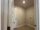Convenient laundry room equipped with washer and dryer hookups and ample storage space at 120 Dogwood Drive Cir, Ocala, FL 34472