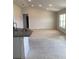 Open living room with neutral carpet, a large window and bright lighting at 120 Dogwood Drive Cir, Ocala, FL 34472