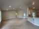 Open-concept living space with recessed lighting, and a seamless flow from kitchen to living area at 120 Dogwood Drive Cir, Ocala, FL 34472