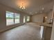Spacious living room featuring tile floors, neutral tones, large windows, and great natural light at 120 Dogwood Drive Cir, Ocala, FL 34472
