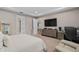 Carpeted main bedroom with neutral walls and a large window for natural lighting and comfortable living at 1229 Hillcrest View Loop, Apopka, FL 32703