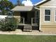 Back porch with steps and access to back yard at 14180 Se 53Rd Ave, Summerfield, FL 34491