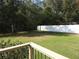 Spacious back yard with a privacy fence and mature trees at 14180 Se 53Rd Ave, Summerfield, FL 34491