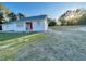 Single story home with a bright red front door and spacious green lawn at 15040 Sw 29Th St, Ocala, FL 34481