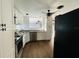 Well-lit kitchen with stainless steel appliances and white cabinets at 15040 Sw 29Th St, Ocala, FL 34481