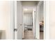 Hallway view of the bathroom and bedroom; showing the layout and flow at 1914 Adair Ln, The Villages, FL 32162