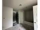 Bathroom featuring a new tub, door, and shower space, ready for customization at 2 Dogwood Crse, Ocala, FL 34472