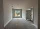 Bright bedroom featuring a window overlooking the yard and white trim at 2 Dogwood Crse, Ocala, FL 34472