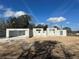 Image of new home construction showing the CMU block walls and a clear, blue sky at 2 Dogwood Crse, Ocala, FL 34472