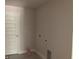 A utilitarian laundry room features hookups for a washer and dryer, plus a utility sink at 2 Dogwood Crse, Ocala, FL 34472