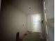 Laundry room with new white door and hookups, ready for appliances at 2 Dogwood Crse, Ocala, FL 34472