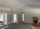 Bright, open-concept living area with neutral walls, carpet, and ample natural light at 2 Dogwood Crse, Ocala, FL 34472