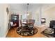 Bright dining room with wood floors, tasteful decor, and natural light from the window and adjacent bedroom at 2251 Nw 50Th Ave, Ocala, FL 34482