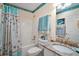 Bright bathroom featuring a shower/tub combo with charming seaside themed decor at 2538 Privada Dr, The Villages, FL 32162