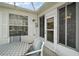 Cozy patio area with outdoor seating, protected by screen and roof at 2538 Privada Dr, The Villages, FL 32162
