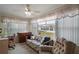 Cozy sunroom featuring ample natural light and relaxed seating at 2538 Privada Dr, The Villages, FL 32162