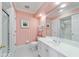 Bright bathroom featuring a large mirror, white vanity, and a shower with glass door at 2775 Sw 53Rd St, Ocala, FL 34471