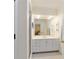 Bright bathroom with a large mirror, white vanity, and a shower with glass door at 2775 Sw 53Rd St, Ocala, FL 34471