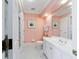 Bright bathroom with a large mirror, white vanity, and shower with glass door at 2775 Sw 53Rd St, Ocala, FL 34471