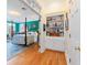Hallway view of a large main bedroom with wooden four poster bed and a sitting area at 2775 Sw 53Rd St, Ocala, FL 34471