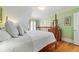 Bedroom featuring hardwood floors, a four-poster bed and natural light at 2775 Sw 53Rd St, Ocala, FL 34471