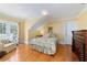 Comfortable bedroom featuring hardwood floors, a full bed, and natural light at 2775 Sw 53Rd St, Ocala, FL 34471