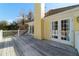 Expansive wooden deck with white railings offering scenic views at 2775 Sw 53Rd St, Ocala, FL 34471
