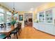 Bright dining room featuring hardwood floors, large windows, and a built-in hutch for elegant storage at 2775 Sw 53Rd St, Ocala, FL 34471
