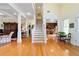Grand foyer featuring hardwood floors, staircase, and access to multiple living spaces at 2775 Sw 53Rd St, Ocala, FL 34471