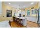 Open concept kitchen with granite countertops, stainless appliances, a gas range, and white cabinets at 2775 Sw 53Rd St, Ocala, FL 34471
