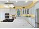 Spacious kitchen featuring granite countertops, stainless appliances, a gas range, and white cabinets at 2775 Sw 53Rd St, Ocala, FL 34471
