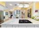 Well-lit kitchen with granite countertops, white cabinets, hardwood floors and stainless appliances at 2775 Sw 53Rd St, Ocala, FL 34471