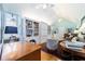The light-filled living room features hardwood floors, white built-in shelving, and comfortable furnishings at 2775 Sw 53Rd St, Ocala, FL 34471