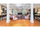 Cozy living room with a fireplace, coffered ceilings, hardwood floors, and elegant furnishings creating a warm ambiance at 2775 Sw 53Rd St, Ocala, FL 34471