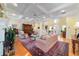 Spacious living room features a fireplace, coffered ceilings, and hardwood floors, with an open layout to other areas at 2775 Sw 53Rd St, Ocala, FL 34471